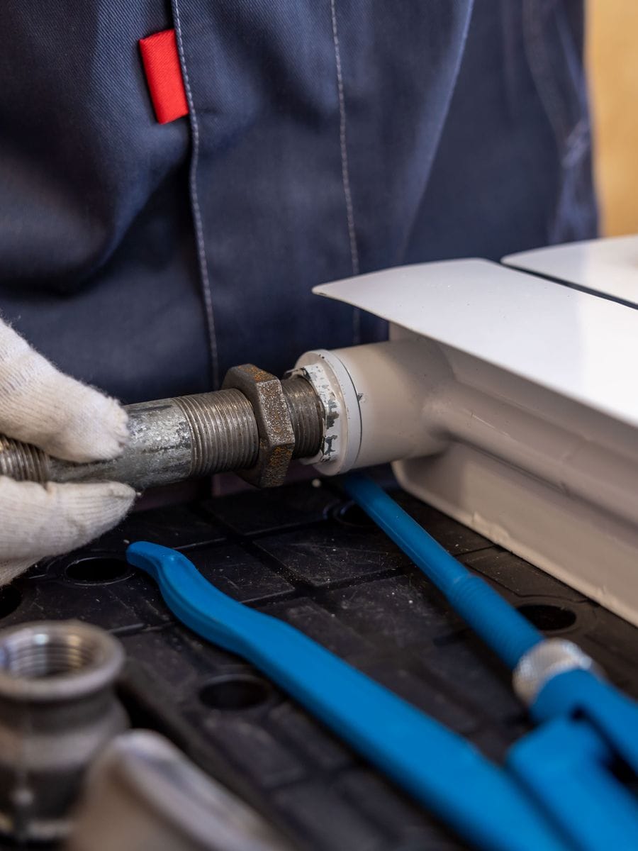 Gas engineer servicing a combi boiler, photographed for a gas engineer website