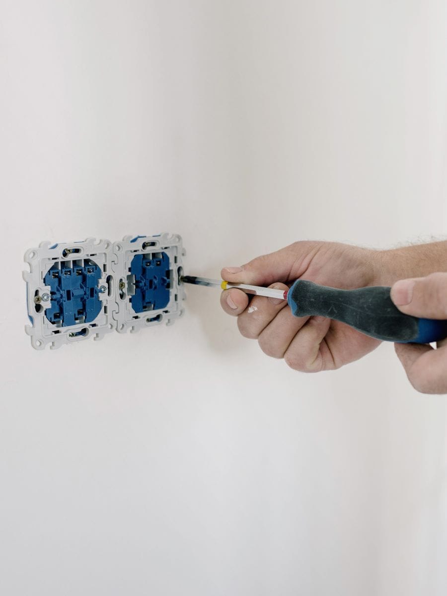 Electrician working on a domestic installation, photographed for an electrician website
