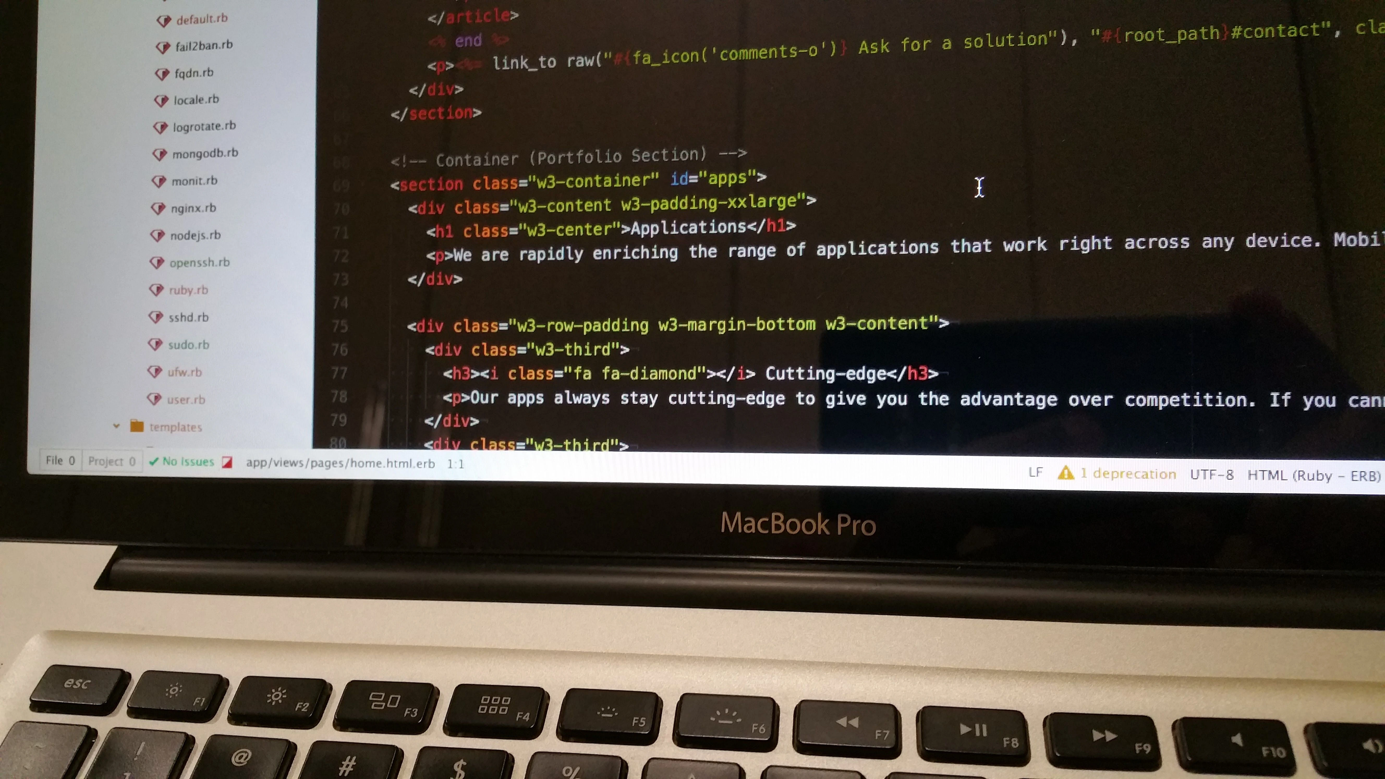 A laptop screen displaying HTML code for a portfolio website, with a file sidebar on the left.